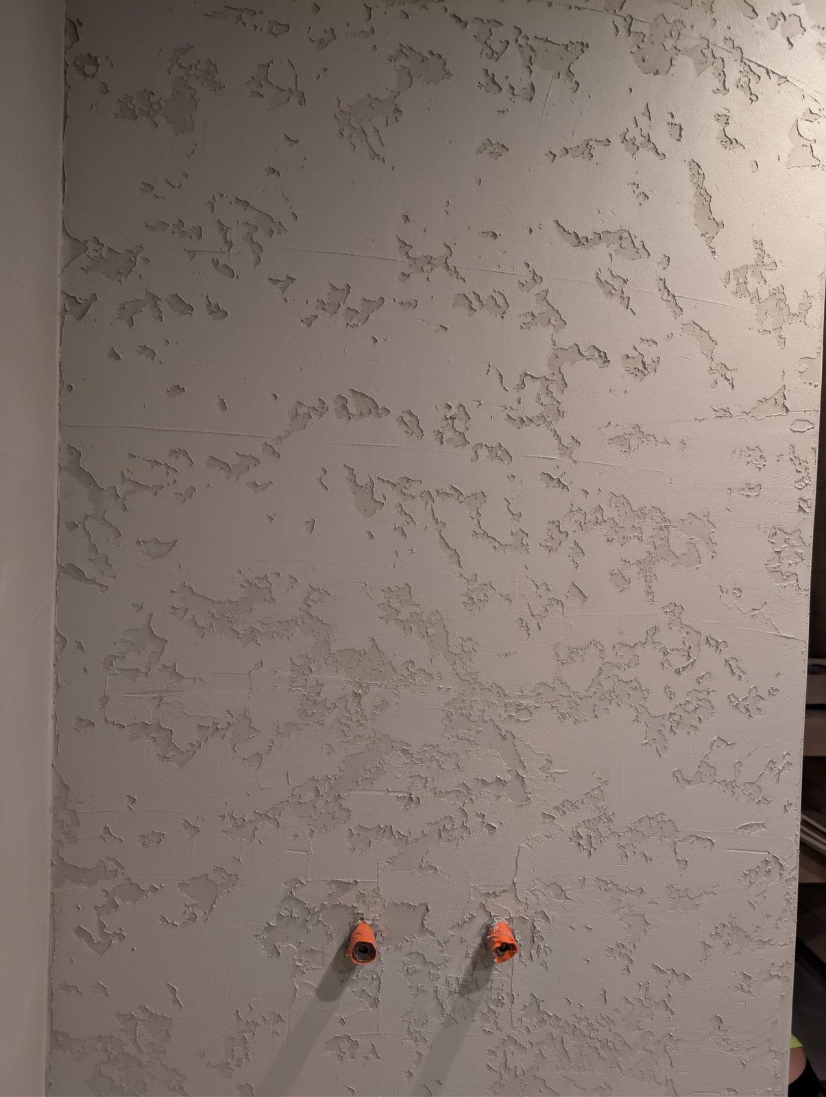Microcement being applied to a wall in Turku